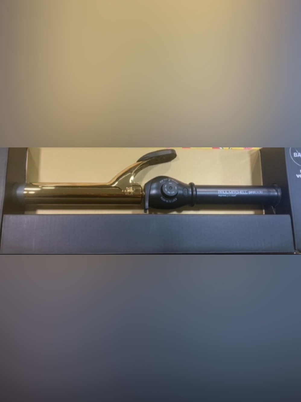 Paul Mitchell Protools
Gold Curling Iron -with adjustable temperature